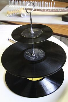 three black records stacked on top of each other