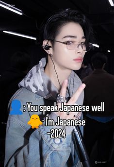 a person wearing glasses and a jean jacket with the words you speak japanese well i'm