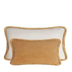 two brown and white pillows on a white background