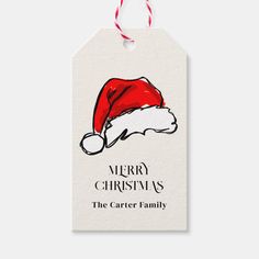 a merry christmas gift tag with a santa hat on the front and back of it