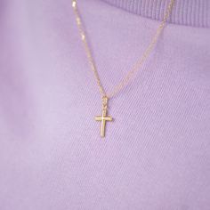 If you're searching for a meaningful gift for your little boy, our 14k yellow gold small plain Baptism cross is a perfect choice. This divine pendant is both simple and elegant, crafted entirely from solid 14k yellow gold. It's a heartwarming way for children to express their love for the cross through religious jewelry, and it complements any of their adorable outfits. Order one for your little angel today, and it will become a cherished part of his jewelry collection for years to come. Your item will arrive impeccably packaged in a gift box, complete with a matching 12" 14k gold chain for easy and thoughtful gifting. Age Group: Lovely for Little Boys & Preteens; Safe for Sensitive Skin Material: 14k Yellow Gold Pendant Size: 15mm x 8mm thin polished cross pendants Chain Length: 12"-16" M Dainty 14k Yellow Gold Cross Necklace, Yellow Gold Cross Necklaces For Baptism, 14k Gold Cross Necklace For First Communion, Yellow Gold Cross Pendant Necklace For First Communion, 14k Yellow Gold Cross Pendant Charm Necklace, Everyday Yellow Gold Cross Charm Necklace, Dainty Yellow Gold Crucifix Cross Necklace, Everyday 14k Yellow Gold Cross Necklace, Dainty Yellow Gold Crucifix Necklace