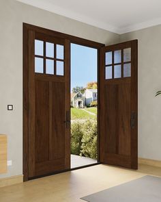 an empty room with two open doors and a potted plant on the floor next to it