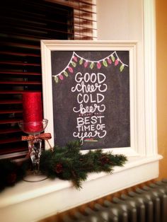 a chalkboard sign on a window sill with christmas decorations