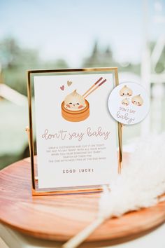 a card that says don't say baby with chopsticks and rice on it