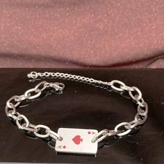 Stainless Steel Ace Of Spades Bracelet. Size: Around 7 Inches Long Plus 2 Inches Extender. Condition: Nwot. Packaging: Includes Cute Paper Box As Shown In The Picture. Red Metal Chain Bracelet Gift, Red Metal Chain Bracelet For Gift, Silver Metal Chain Bracelet For Valentine's Day, Adjustable Silver Chain Bracelet For Valentine's Day, Valentine's Day Silver Metal Chain Bracelet, Red Stainless Steel Bracelet For Gift, Ace Bracelet, Elizabeth Jewelry, Cute Paper