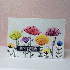 a birthday card with flowers on it