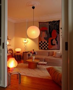 a living room filled with furniture and lamps