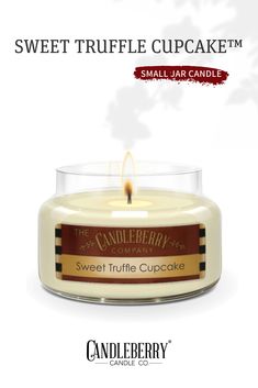 a candle that is sitting in front of a white background with the words sweet truffle cupcake on it