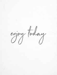 the word enjoy today written in cursive writing on a white paper with black ink