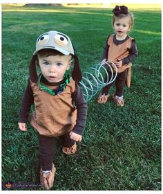 two young children dressed up in costumes