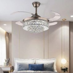 a bedroom with a large bed and a ceiling fan in the middle of the room