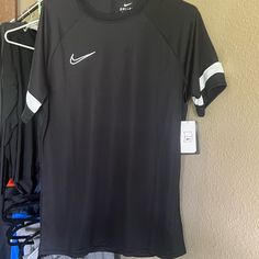 Nike Black Tee Nike Sporty Black T-shirt, Black Sporty Short Sleeve Shirt, Black Crew Neck Shirt For Sports, Nike Black Sports Top, Nike Black Crew Neck Top, Nike Black Sporty T-shirt, Nike Black Shirt For Streetwear, Nike Black Tops For Streetwear, Nike Black Casual Shirt