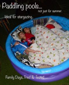 two children laying in an inflatable pool with text reading paddling pools ideal for stargazing