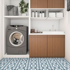 a washer and dryer in a small room with shelves above the washer