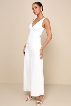 The Lulus Sweet Eloquence White Lace Back Sleeveless Wide-Leg Jumpsuit is an aisle-approved look that will enhance the lovely vibes of your big day! Stretchy crepe knit shapes this gorgeous jumpsuit that features a sleeveless, seamed bodice with a flirty V-neckline, wide shoulder straps, and sheer panels of romantic lace that accent the back. The high, fitted waist sits atop trendy wide pant legs that fall to ankle-length hems. Hidden side zipper/clasp. Fit: This garment fits true to size. Lengt Fitted Sleeveless Bridesmaid Jumpsuits And Rompers, Fitted Sleeveless Bridesmaid Jumpsuit, Chic Sleeveless Jumpsuit For Wedding Guest, Fitted Summer Jumpsuit For Bridesmaids, Summer Wedding V-neck Jumpsuits And Rompers, Sleeveless Jumpsuits And Rompers For Wedding Guest, Elegant Sleeveless Jumpsuit For Bridesmaids, Elegant Sleeveless Jumpsuits And Rompers For Bridesmaids, Chic Sleeveless Jumpsuit For Wedding