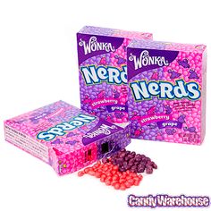 two boxes of weird nerds candy with pink and purple candies next to them