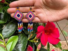 These earrings reflect the cultural traditions of indigenous artisans from Chiapas Mexico.  Whether you are looking for everyday jewelry or statement pieces, we got you covered! These beautiful beaded earrings are unique, lightweight, and perfect for any occasion.  They also make great gifts.  * If you would like some more pictures of these lovely earrings don't hesitate to message me. As a special thank you every shipment will receive a FREE GIFT!! Thank you for visiting - Gracias por visitarno Artisan Beaded Drop Earrings For Festival, Artisan Handwoven Beaded Drop Earrings, Artisan Beaded Dangle Earrings, Fair Trade, Artisan Handwoven Earrings For Festivals, Artisan Handwoven Festival Earrings, Artisan Fair Trade Beaded Dangle Earrings, Artisan Drop Earrings With Colorful Beads, Multicolor Fair Trade Beaded Earrings For Gifts, Multicolor Bohemian Earrings For Fiesta