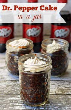 three jars filled with desserts sitting on top of a table