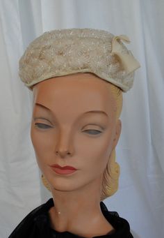 "This is a lovely vintage ladies' hat, from the 50s or 60s. Label reads, \"Valerie Modes\" . One size fits all, as it just perches on the head. It is made of mesh like, tubes of nylon mesh, woven in an intricate pattern. It has a little, ribbon loop trim in front. Edges & center of the dome of the hat are fabric. Inside is a mesh form. The hat is in very good, vintage condition. The only flaw is a little discoloration on front edge fabric. No other soil, discoloration or damage. Chic!!" Pillbox Hat, Pleated Bodice, The 50s, Chic Vintage, Vintage Chic, Vintage Boutique, Pleated Dress, One Size Fits All, Cream Color