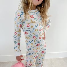 This Pima Cotton Pajamas offers the perfect combination of comfort and durability for a peaceful night's sleep. Made with organic pima cotton, these pajamas provide a snugged fit with a fun doodle print. Your little one will love the buttery soft feeling of this PJ set every night. 100% Organic Pima Cotton Ribbed neckline, cuffs and hems Snugged Fit Made in Peru Playful Printed Sleepwear With Relaxed Fit, Playful Printed Sleepwear In Relaxed Fit, Playful Printed Relaxed Fit Sleepwear, Printed Relaxed Fit Playful Sleepwear, Playful Multicolor Sleepwear For Loungewear, Playful Graphic Print Loungewear Sets, Playful Graphic Print Sleepwear, Playful Sleepwear With Graphic Print For Sleepovers, Playful Graphic Print Sleepwear For Sleepovers