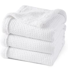 three white towels stacked on top of each other