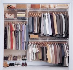 an organized closet with clothes and shoes