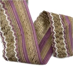 two pieces of purple and gold woven material with white stripes on the edges, set against a white background