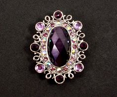 This Monet Purple Rhinestone Brooch Estate Jewelry is the item you will receive when ordering. This purple brooch is is great vintage condition. Please inspect the pictures and descriptions carefully. All major flaws, chips, and cracks will be noted in the pictures and/or descriptions. Vintage and antique items will have minor flaws and wear due to age. Please don't expect a pristine, like-new item. Customer satisfaction is my number one priority. If you are happy with your purchase, please tell Vintage Purple Brooch For Party, Victorian Rhinestone Brooches For Gifts, Purple Rhinestones Brooch As A Gift, Victorian Style Rhinestone Brooches As Gift, Vintage Purple Brooches For Party, Purple Rhinestone Brooches For Gifts, Purple Rhinestone Brooches As A Gift, Purple Rhinestone Brooches As Gifts, Costume Jewelry Bling Brooches For Gifts