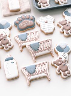 baby shower cookies are arranged on a table