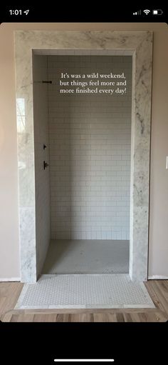 a white tiled shower stall with the words, it's was a walk - in