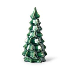 a green ceramic christmas tree on a white background