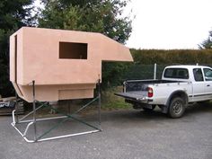 a truck with a house built into the back of it