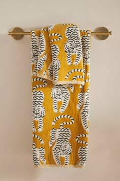 a towel hanging on the wall with an animal print