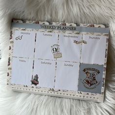 a harry potter themed weekly planner on a furry surface