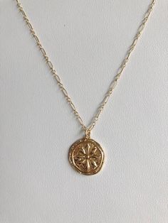 Small gold filled rustic coin pendant with a simple raised daisy design. Long and short link gold filled chain with a lobster clasp. Great for layering. Dainty 14k Gold-filled Medallion Jewelry, Dainty 14k Gold Filled Medallion Jewelry, Dainty Everyday Medallion Necklace, Everyday 14k Gold-filled Coin Necklace, Dainty 14k Gold Filled Tarnish Resistant Coin Necklace, Gold Jewelry With Flower Charm For Everyday, Dainty Medallion Necklace For Everyday, Gold Dainty Coin Necklace For Everyday, Gold Dainty Medallion Necklace For Everyday