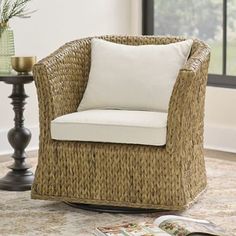 a wicker chair sitting on top of a rug