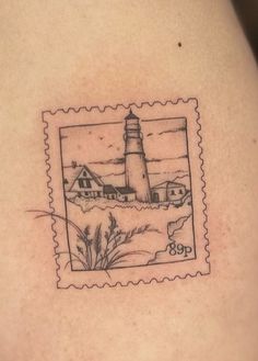 a stamp with a lighthouse on it is shown in black and grey ink, as well as an image of the ocean