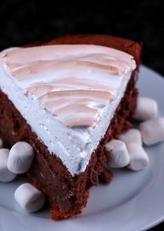 a slice of chocolate cake with marshmallows on top