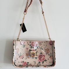 Excellent Condition. Crossbody Bag By Bebe. Plastic See Through Bag With Removable Floral Pouch. Pink Floral With Gold Tone Hardware. Measures 11" Wide And 7" Tall. Inside Pocket Feminine Rectangular Bag For On-the-go, Feminine Shoulder Bag With Chain Strap, Pink Shoulder Bag With Chain Strap, Pink Crossbody Shoulder Bag With Detachable Strap, Pink Shoulder Bag With Chain Strap For Everyday, Feminine Rectangular Shoulder Bag With Chain Strap, Spring Pink Pouch Shoulder Bag, Pink Pouch Shoulder Bag With Chain Strap, Pink Crossbody Shoulder Bag With Detachable Handle