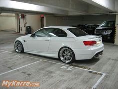 a white car parked in a parking garage