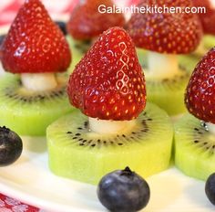 sliced kiwis and strawberries on a plate