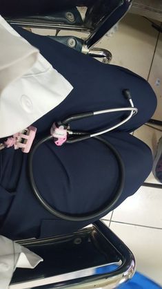 a doctor's stethoscope sitting on top of a chair