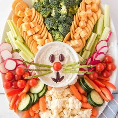 a white plate topped with vegetables and veggies