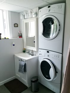 a washer and dryer in a small bathroom