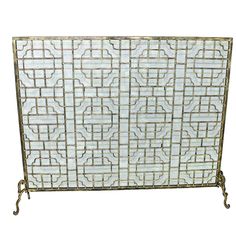 a metal screen with an intricate design on the top and bottom, against a white background