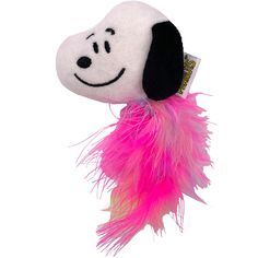 a dog toy with a pink feather on it's tail and a smiling face