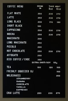 a menu for coffee is displayed on the wall