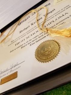 a diploma with a gold seal on it