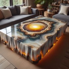 a coffee table with an artistic design on it in the middle of a living room