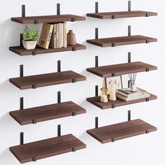 several wooden shelves with books and plants on them